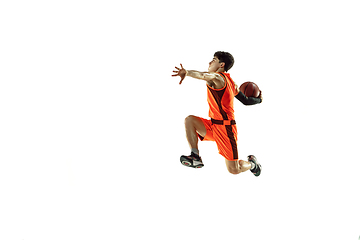 Image showing Young basketball player training isolated on white studio background