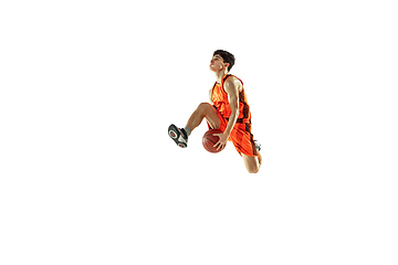 Image showing Young basketball player training isolated on white studio background