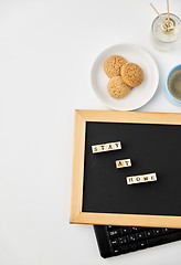 Image showing chalkboard with stay at home words on toy blocks