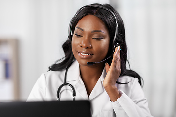 Image showing african doctor with headset and laptop at hospital