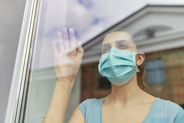 Image showing sick young woman wearing protective medical mask