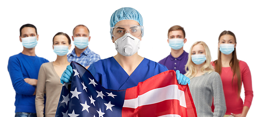 Image showing doctor in goggles and mask holding flag of america