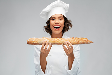 Image showing happy female chef with french bread or baguette