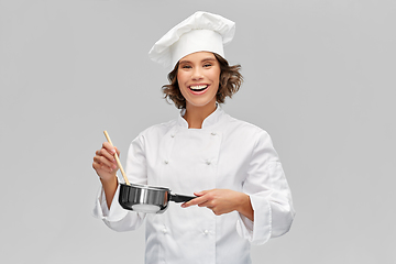 Image showing happy smiling female chef with saucepan