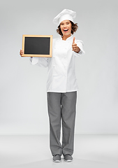 Image showing happy chef with chalkboard showing thumbs up