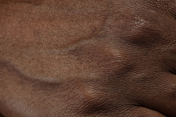 Image showing Texture of human skin. Close up of african-american male body