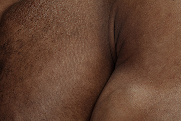 Image showing Texture of human skin. Close up of african-american male body