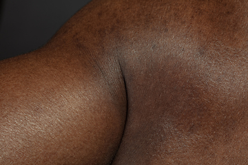 Image showing Texture of human skin. Close up of african-american male body