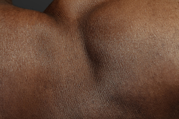 Image showing Texture of human skin. Close up of african-american male body