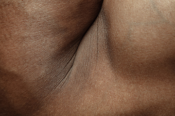 Image showing Texture of human skin. Close up of african-american male body