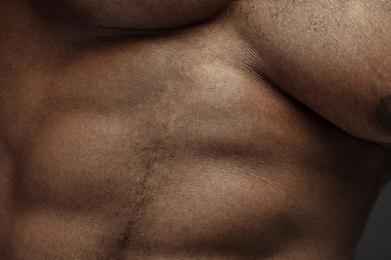 Image showing Texture of human skin. Close up of african-american male body