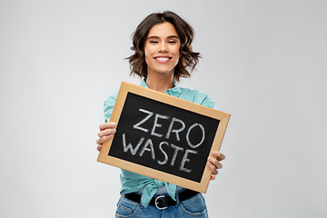 Image showing happy woman with chalkboard with zero waste words