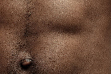 Image showing Texture of human skin. Close up of african-american male body