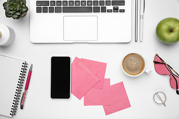 Image showing Flat lay, mock-up. Feminine home office workspace, copyspace