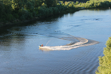 Image showing couple of people in quadski going on the river