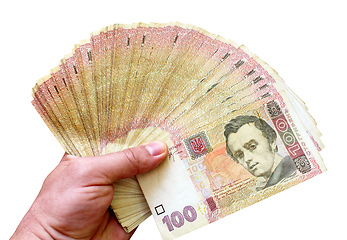 Image showing Ukrainian money of value 100 in the hand isolated
