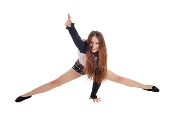 Image showing Young happy woman crouching on the floor