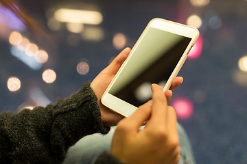 Image showing Woman holding cellphone