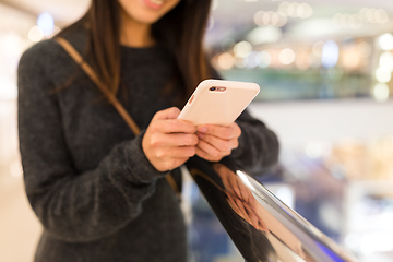 Image showing Woman working on mobile phone