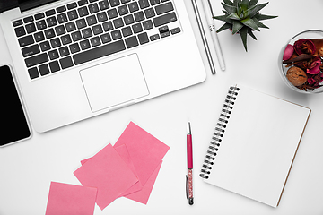 Image showing Flat lay, mock-up. Feminine home office workspace, copyspace