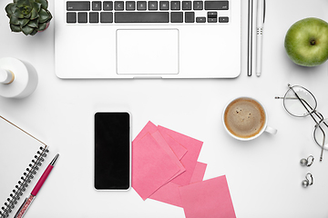 Image showing Flat lay, mock-up. Feminine home office workspace, copyspace