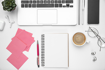 Image showing Flat lay, mock-up. Feminine home office workspace, copyspace