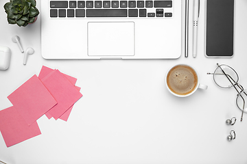 Image showing Flat lay, mock-up. Feminine home office workspace, copyspace