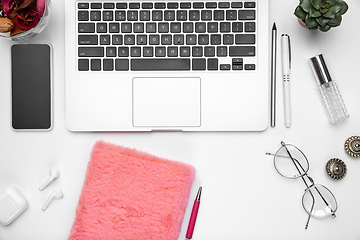 Image showing Flat lay, mock-up. Feminine home office workspace, copyspace