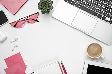 Image showing Flat lay, mock-up. Feminine home office workspace, copyspace