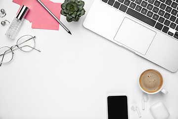 Image showing Flat lay, mock-up. Feminine home office workspace, copyspace