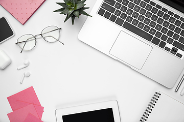 Image showing Flat lay, mock-up. Feminine home office workspace, copyspace