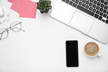 Image showing Flat lay, mock-up. Feminine home office workspace, copyspace