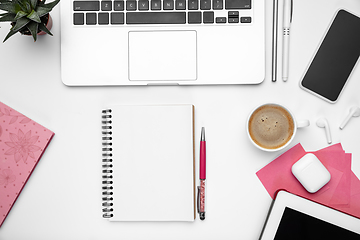 Image showing Flat lay, mock-up. Feminine home office workspace, copyspace