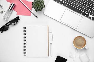 Image showing Flat lay, mock-up. Feminine home office workspace, copyspace