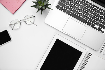 Image showing Flat lay, mock-up. Feminine home office workspace, copyspace