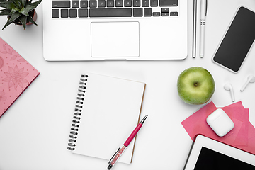 Image showing Flat lay, mock-up. Feminine home office workspace, copyspace