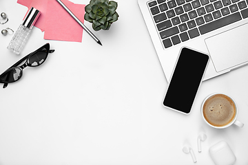 Image showing Flat lay, mock-up. Feminine home office workspace, copyspace