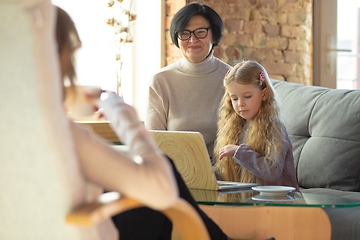 Image showing Happy loving family. Grandmother, mother and daughter spending time together