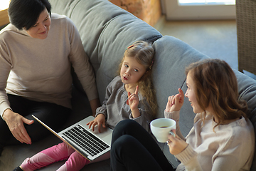 Image showing Happy loving family. Grandmother, mother and daughter spending time together