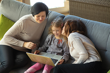 Image showing Happy loving family. Grandmother, mother and daughter spending time together