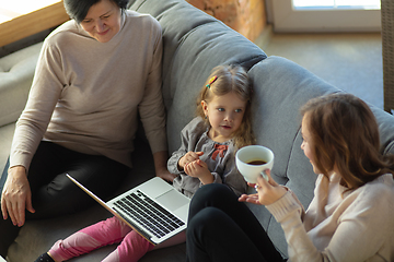 Image showing Happy loving family. Grandmother, mother and daughter spending time together