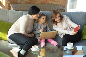 Image showing Happy loving family. Grandmother, mother and daughter spending time together