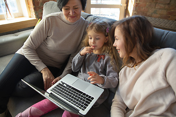 Image showing Happy loving family. Grandmother, mother and daughter spending time together