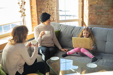 Image showing Happy loving family. Grandmother, mother and daughter spending time together