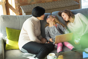 Image showing Happy loving family. Grandmother, mother and daughter spending time together