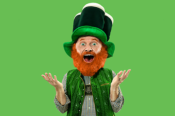 Image showing Excited leprechaun in green suit with red beard on white background