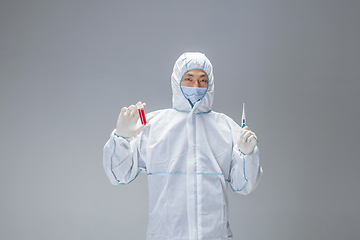 Image showing Medic in white hazmat protective suit, coronavirus illustration concept