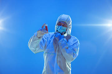 Image showing Medic in white hazmat protective suit, coronavirus illustration concept