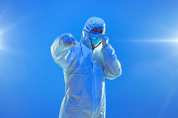 Image showing Medic in white hazmat protective suit, coronavirus illustration concept