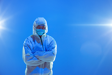 Image showing Medic in white hazmat protective suit, coronavirus illustration concept